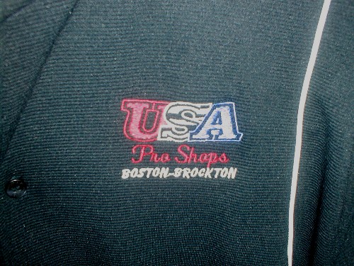 Detail on the left breast work, showing the pro shop "logo".